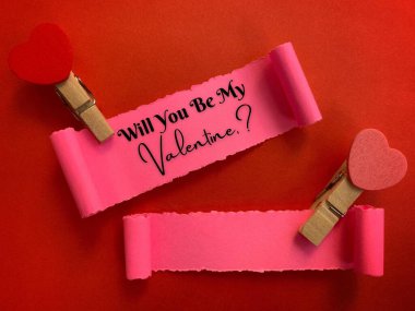Will you be my valentine label on torn paper with red paper background. Valentines Day concept