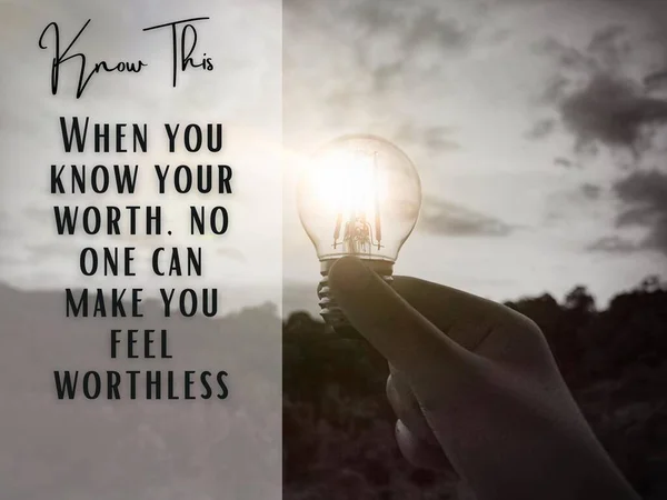 Inspirational quotes - When you know your worth, no one can make you feel worthless. With black and white bulb and blurred trees background. Motivational concept. — Stock fotografie