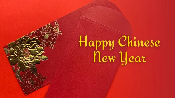 Chinese New Year celebration with Happy New Year wishes on red envelope with red cover background. Conceptual — Stock Photo, Image