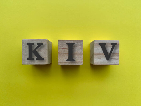 Alphabets of KIV on wooden blocks with yellow background.