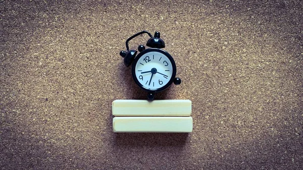 Top view of alarm clock on wooden blocks. Copy space concept — Stock Photo, Image