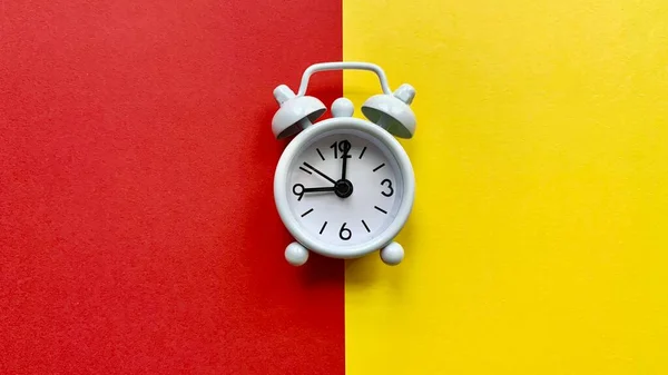 Alarm clocks on red and yellow background. Copy Space concept — Stock Photo, Image