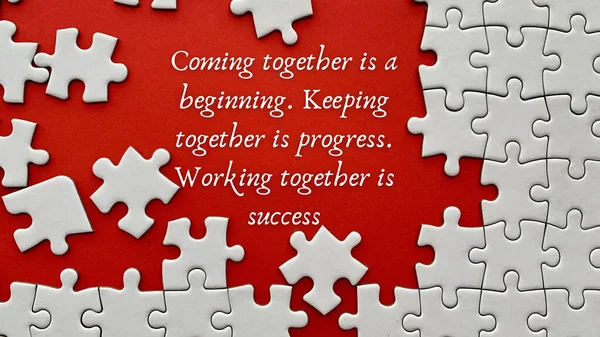 Top view of teamwork inspirational quote on red cover with jigsaw puzzle. Motivational and inspirational concept. — Stock Photo, Image