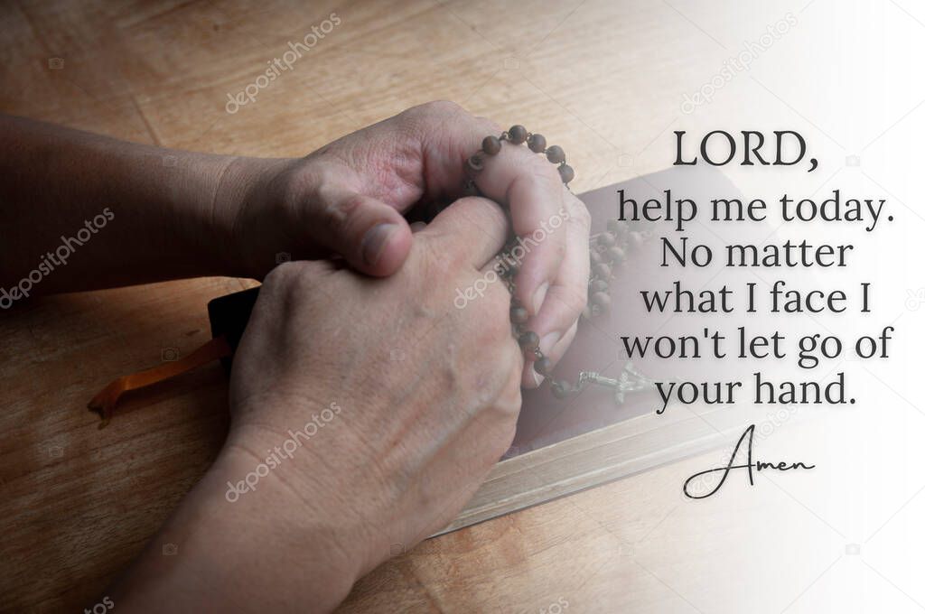 Christian prayer text with hand holding Rosary on a Holy Bible background. Christianity and prayer concept.