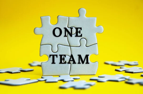 One Team Text Jigsaw Puzzle Yellow Background Teamwork Business Concept — ストック写真
