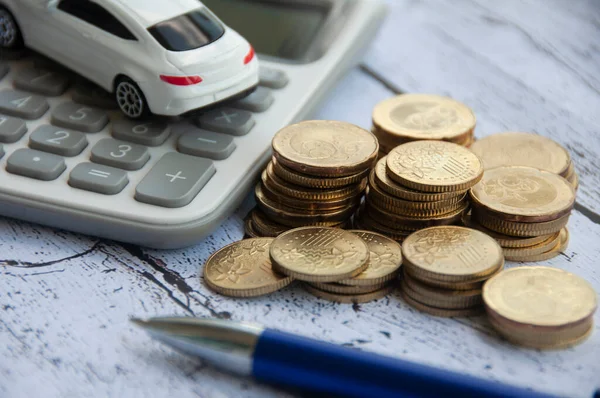 Gold Coins Calculator White Car Toy Pen Wooden Background Selective — Stockfoto