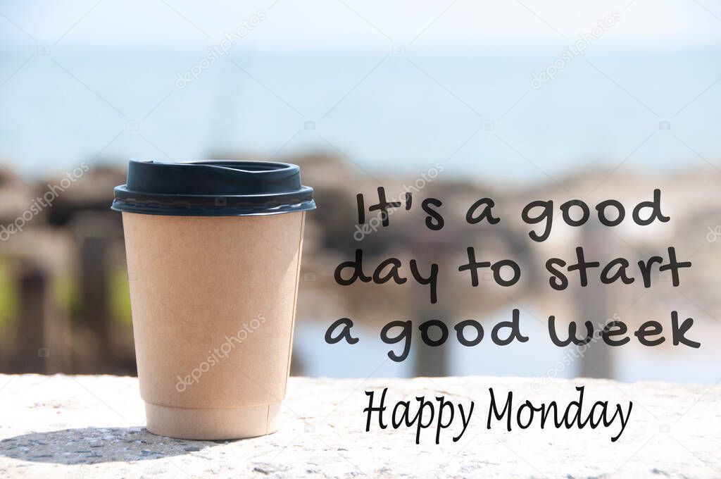 It is a good day to start a good week text with coffee cup and blurred beach background.