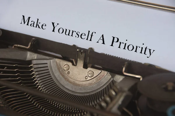 Make yourself a priority typed on a vintage typewriter. Motivational concept
