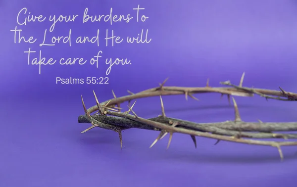 Christian prayer text with crown of thorns on purple cover background. Christianity concept.