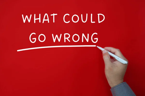 What could go wrong text on red cover background. Problem solving concept