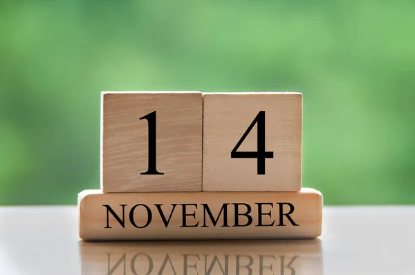 November 14 calendar date text on wooden blocks with copy space for ideas or text. Copy space and calendar concept