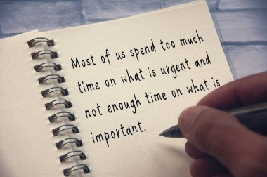 Life inspirational quote - Most of us spend too much time on what is urgent and not enough time on what is important. Inspirational concept.