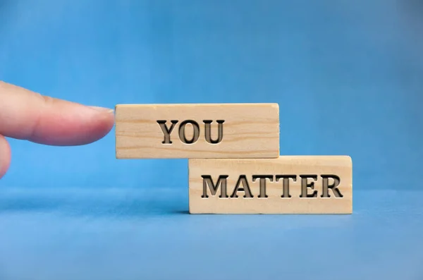 Finger Pointing You Matter Text Engraved Wooden Block Inspirational Concept — Stockfoto