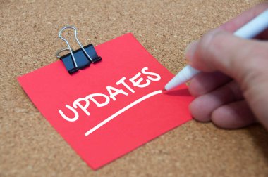Update text on red notepad with wooden cover background. Update concept.
