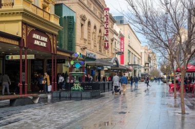 Adelaide, South Australia - August 10, 2019: Iconic Adelaide Arcade fountain viewed along the Rundle Mall after the rain