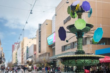 Adelaide, South Australia - August 10, 2019: Iconic Adelaide Arcade fountain viewed along the Rundle Mall after the rain