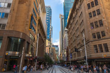 Sydney, Australia - April 16, 2022: George street viewed towards North with crowds of people walkig along the shops on a day