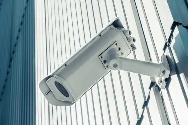 Outdoor street CCTV Security camera installed on the building wall in the city