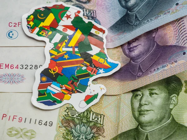 african map with flags on chinese yuan bills, belt and road investment concept