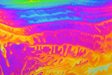 Psikedelik çok renkli arkaplan soyutlaması. Gökkuşağı renkleri. kalıplar. Sabun köpüklerinin makro fotoğraf çekimi