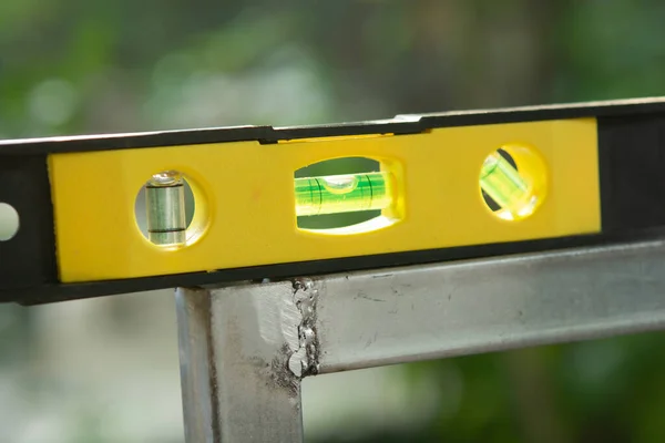 Spirit level or construction water level on steel pipe