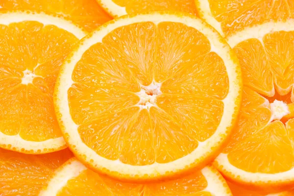 Navel orange slices background, top view, flat lay,