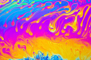 Psikedelik çok renkli arkaplan soyutlaması. Gökkuşağı renkleri. kalıplar. Sabun köpüklerinin makro fotoğraf çekimi