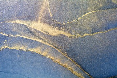 Blue and gold alcohol ink technique blue and gold. Luxury abstract fluid art painting background. 