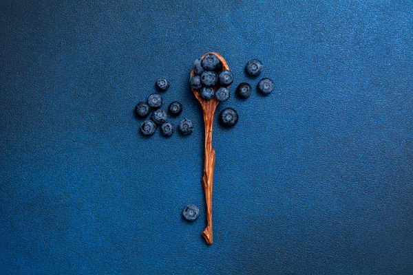 Fresh Blueberries Wooden Spoon Berries Blue Background View — Stockfoto