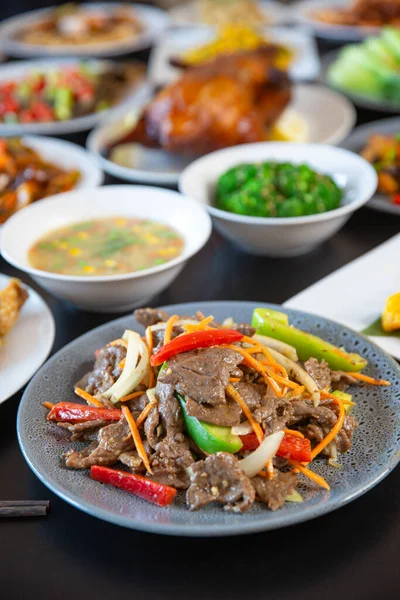 Top view food platter combo set of traditional Cantonese yum-cha Asian gourmet cuisine meal food dish on the white serving plate on the table, includes dishes of duck, pork, fish, chicken, vegetables