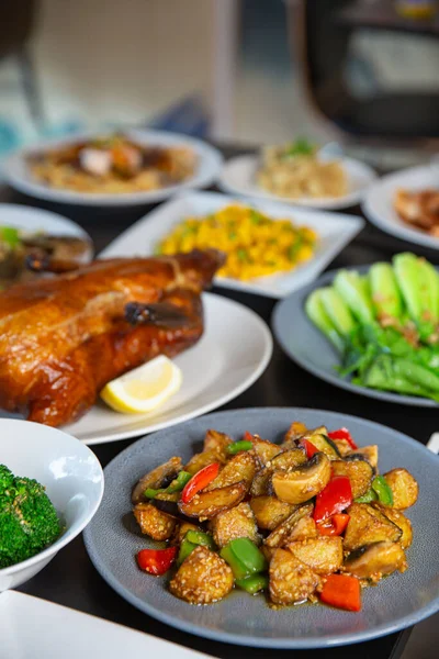 Food platter combo set of traditional Cantonese yum-cha Asian gourmet cuisine meal food dish on the white serving plate on the table, includes dishes of duck, pork, fish, chicken, vegetables