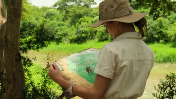 Girl Tourist Travel Overalls Safari Hat Stands Amazon Looks Route — стоковое видео