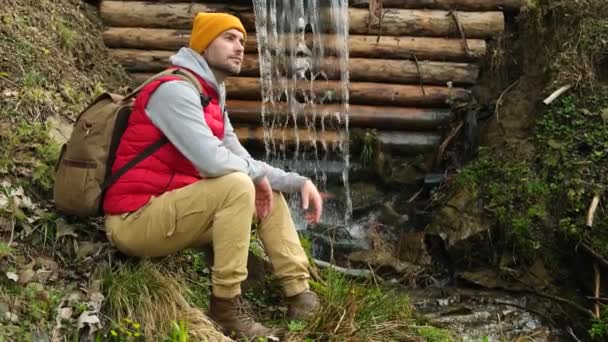 Traveler Sits Stone Climbing Mountains Resting Mountain River Waterfall River — Stockvideo