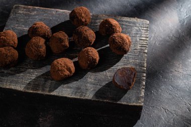 Dark chocolate truffle on dark background