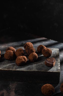 Dark chocolate truffle on dark background