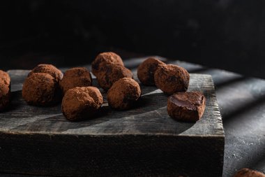 Dark chocolate truffle on dark background