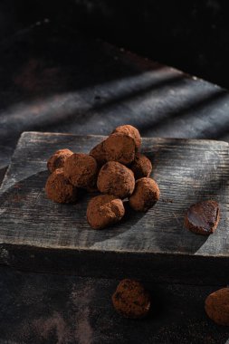 Dark chocolate truffle on dark background
