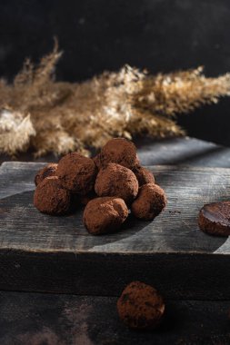 Dark chocolate truffle on dark background