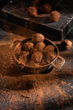 Dark chocolate truffle on dark background