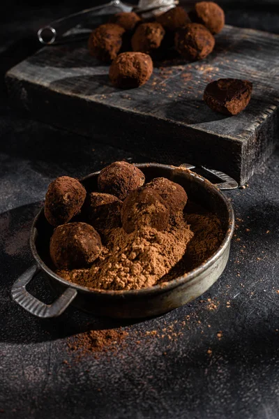 Dark chocolate truffle on dark background