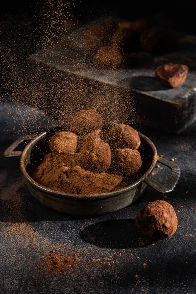 Dark chocolate truffle on dark background