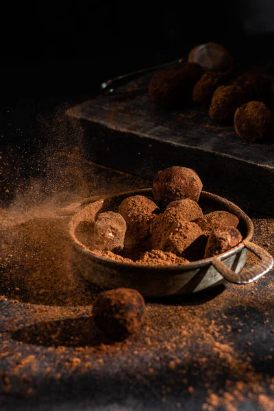 Dark chocolate truffle on dark background