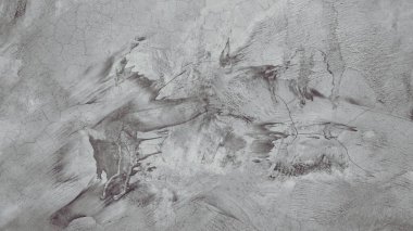 Eski beton duvar yıpranmış, yüzeyi çizilmiş, yüzeyi çizilmiş ve hasar görmüştü. Esrarengiz eski-muhafazakar bir arka plan için.