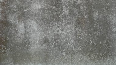 Eski beton duvar yıpranmış, yüzeyi çizilmiş, yüzeyi çizilmiş ve hasar görmüştü. Esrarengiz eski-muhafazakar bir arka plan için.