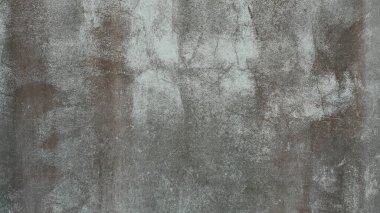 Eski beton duvar yıpranmış, yüzeyi çizilmiş, yüzeyi çizilmiş ve hasar görmüştü. Esrarengiz eski-muhafazakar bir arka plan için.