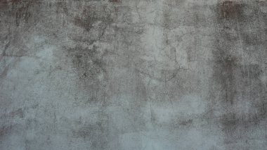 Eski beton duvar yıpranmış, yüzeyi çizilmiş, yüzeyi çizilmiş ve hasar görmüştü. Esrarengiz eski-muhafazakar bir arka plan için.