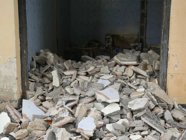 Close-up of the rubble of an industrial building collapsing into a pile of concrete and brick. and the jagged debris caused by the failure of the engineers at the abandoned construction.