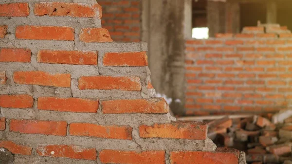 Close-up of the rubble of an industrial building collapsing into a pile of concrete and brick. and the jagged debris caused by the failure of the engineers at the abandoned construction.