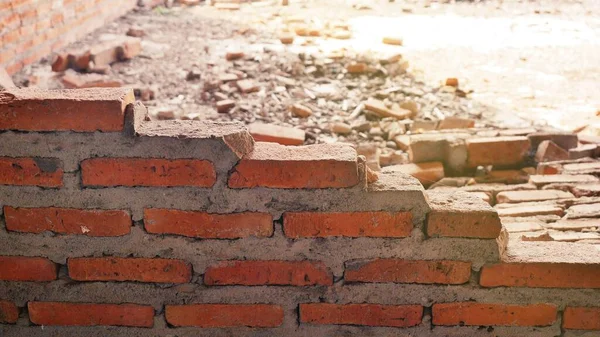 Close-up of the rubble of an industrial building collapsing into a pile of concrete and brick. and the jagged debris caused by the failure of the engineers at the abandoned construction.