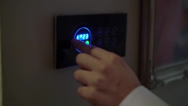Air conditioning control panel. Man operates buttons on climate control panel. — Stockvideo